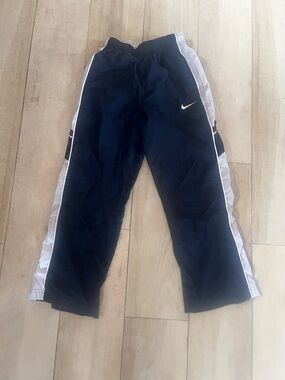Nike Kids Navy Blue wind pant Joggers with White Side Stripes